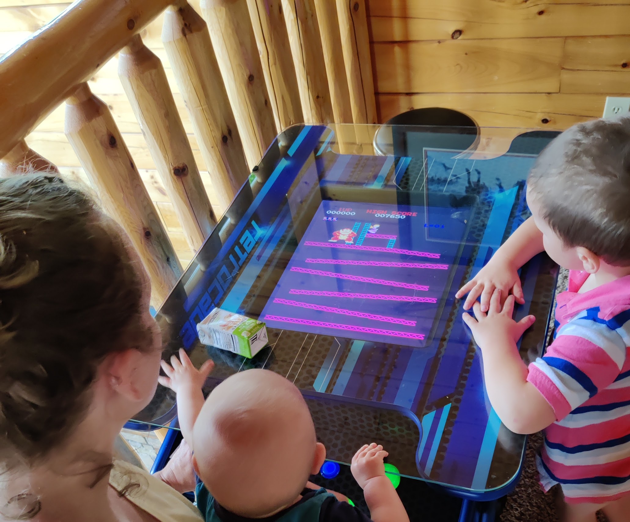 a group of children playing a video game