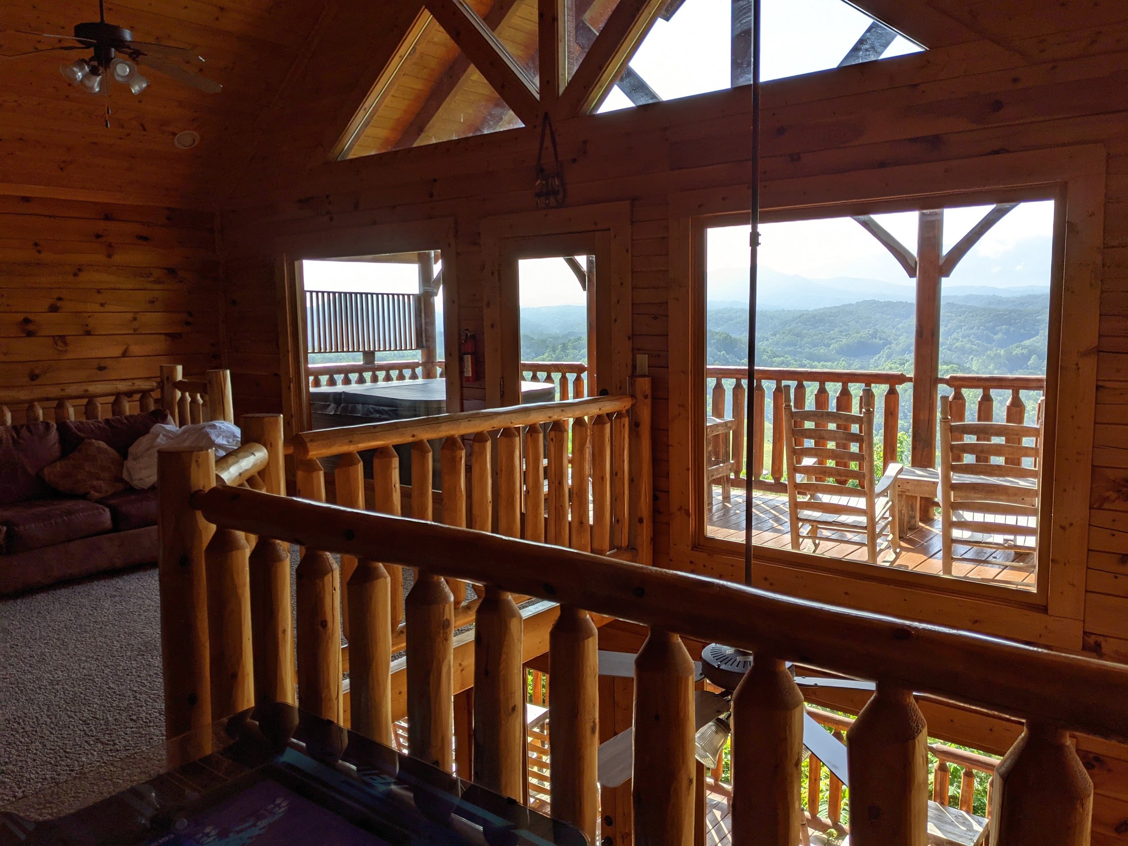 a view of a log cabin from a balcony