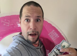 a man holding a dollar bill and a pink float
