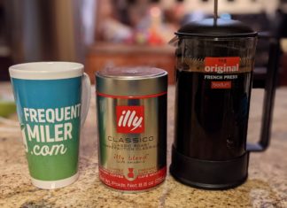 a coffee maker and a mug