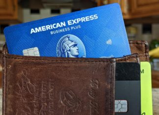 a wallet with a credit card and a credit card inside