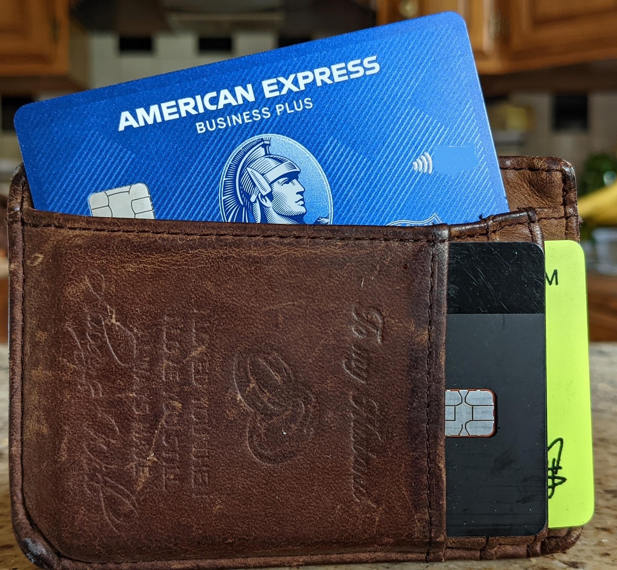 a wallet with a credit card and a credit card inside
