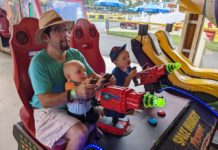 a man and two boys playing a game