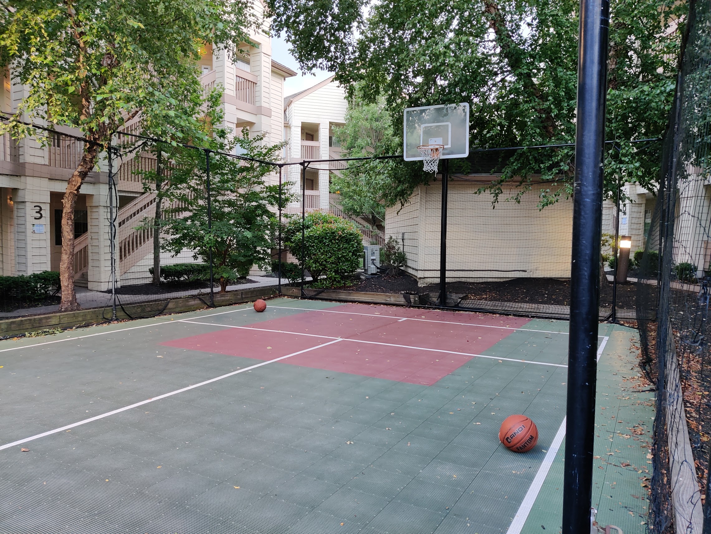 a basketball court with a net and a basketball ball