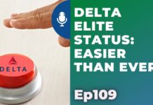 a finger pressing a red button