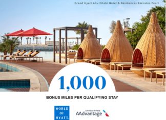 a pool with lounge chairs and a gazebo