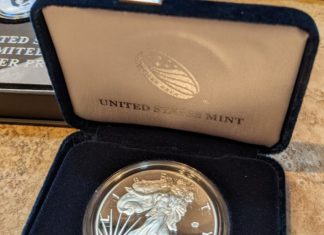 a silver coin in a box