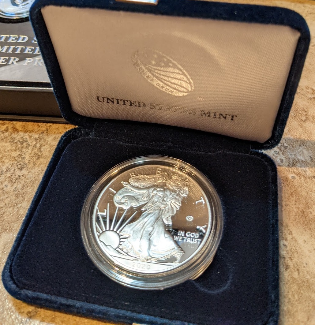 a silver coin in a box