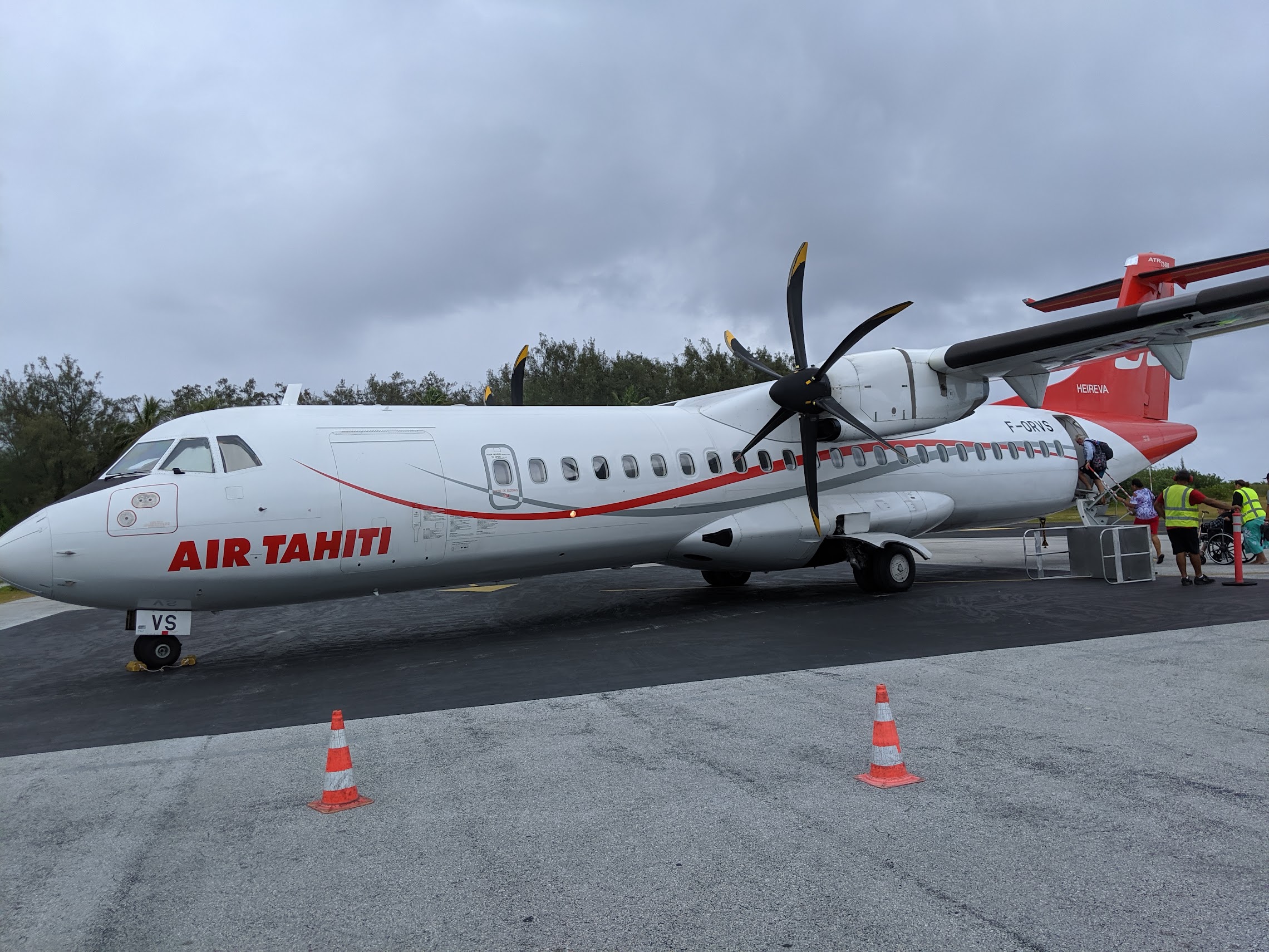 a white airplane with red writing on it