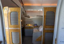 an airplane with a small bed and a small desk