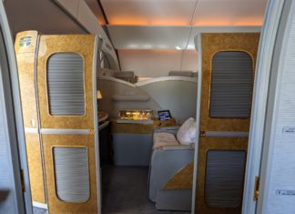 an airplane with a small bed and a small desk