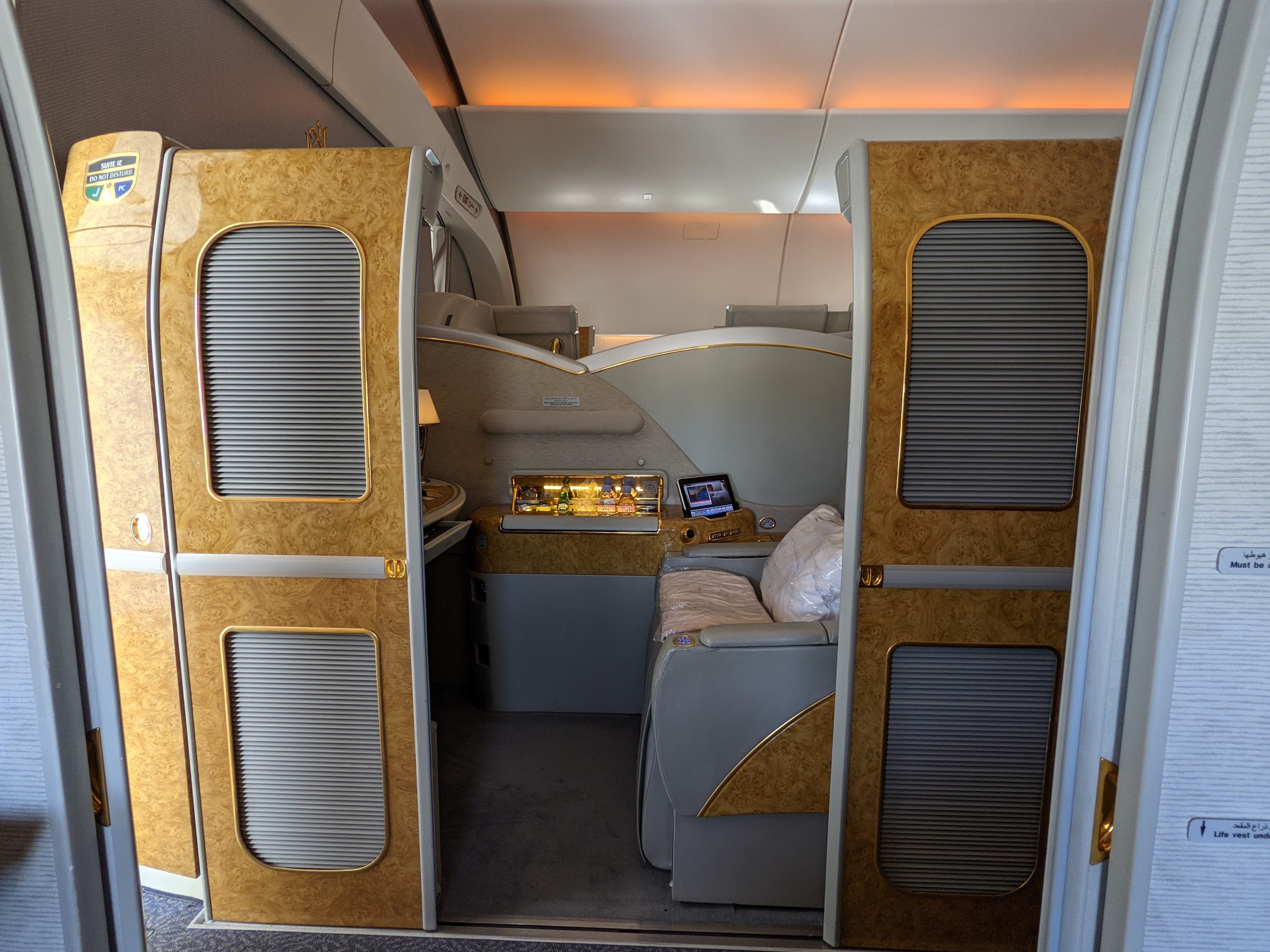 an airplane with a small bed and a small desk