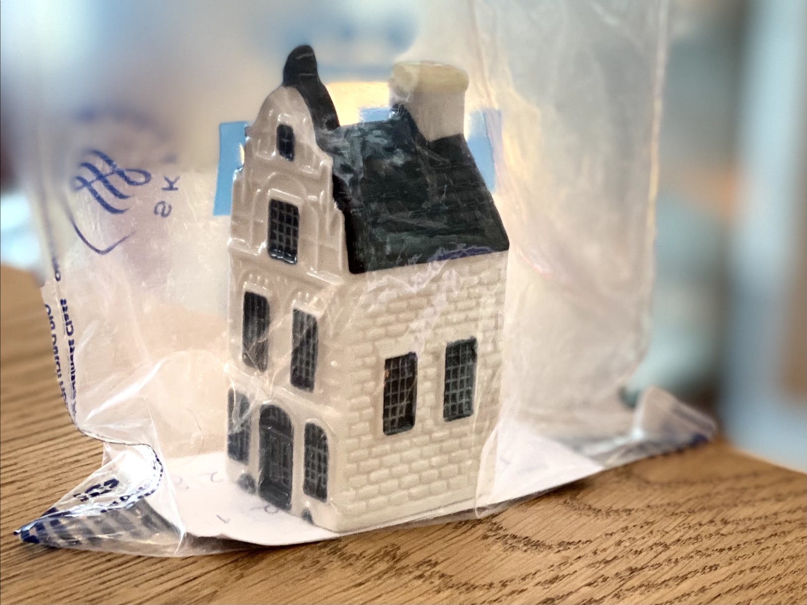 a small white house in a plastic bag