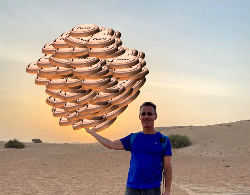 a man holding up a large pile of coins