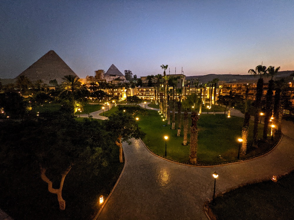 Property & pyramid view at night