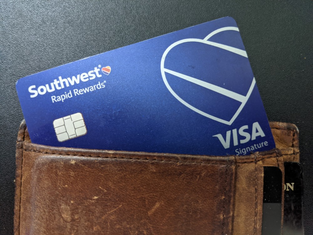 a blue credit card in a wallet