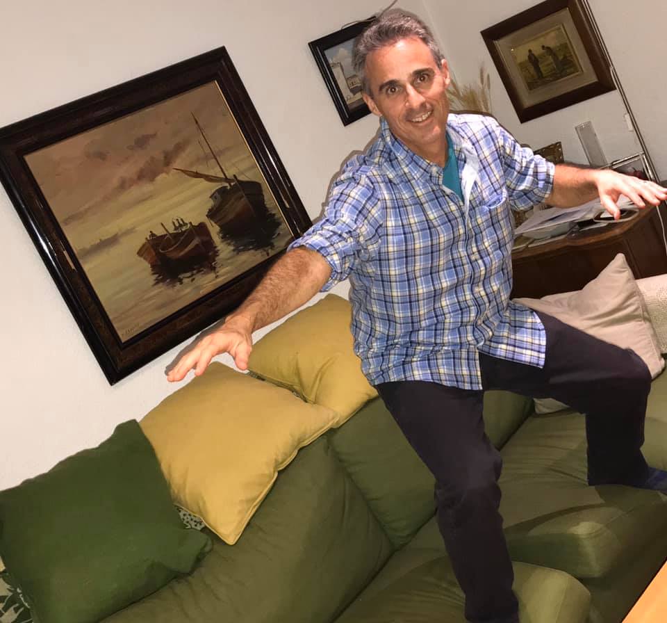 a man standing on a couch