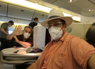 a man wearing a face mask and a hat