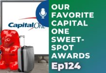 a red suitcase next to a white board