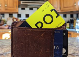 a wallet with a yellow card inside
