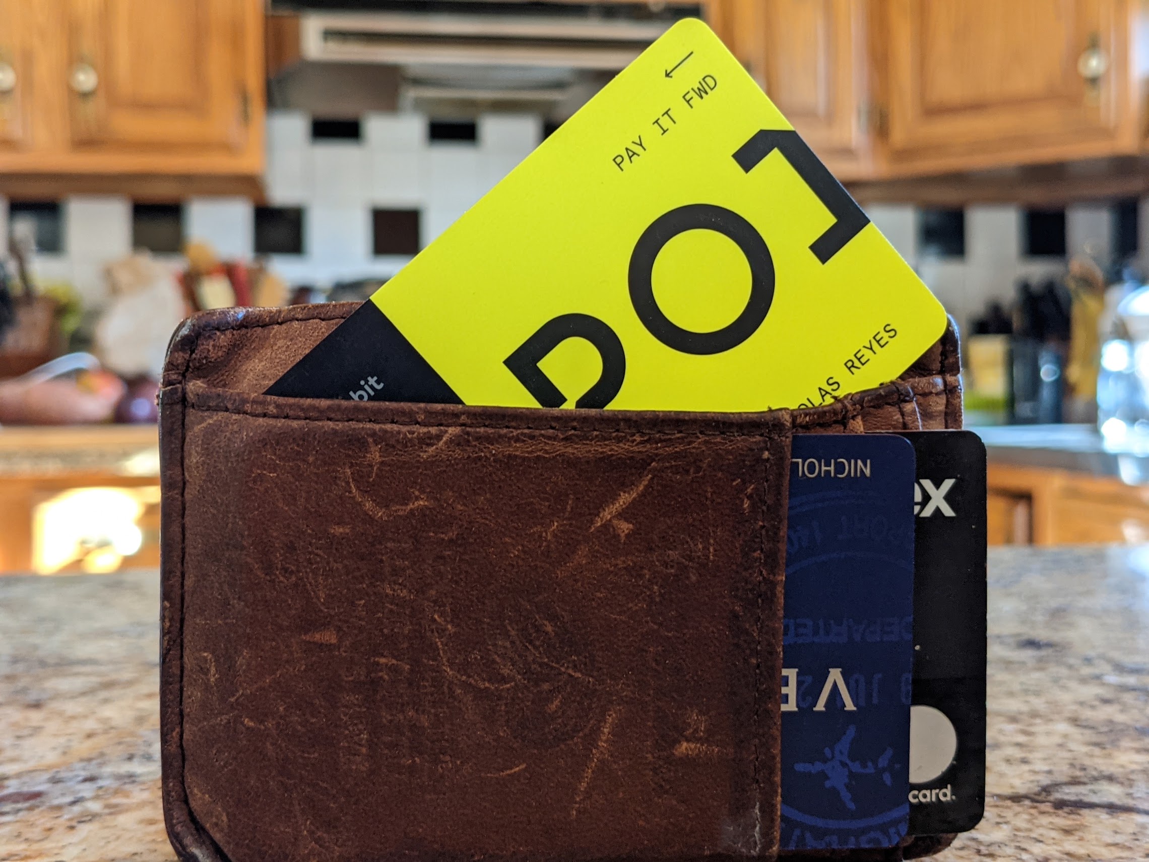 a wallet with a yellow card inside