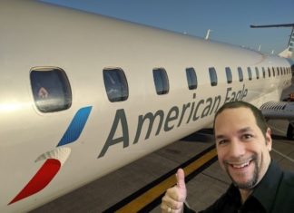 a man standing in front of an airplane