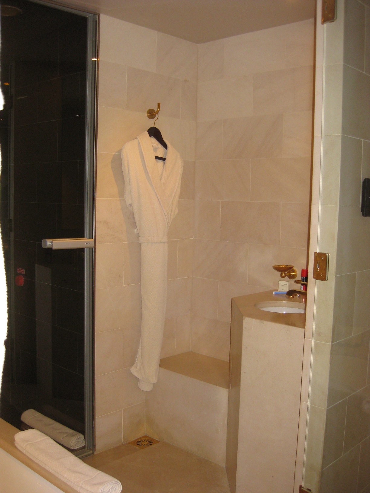 a white bathrobe on a shower