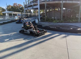 people driving go-karts