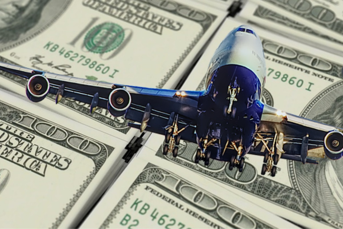 a plane flying over money