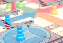 a group of toy airplanes on a game board