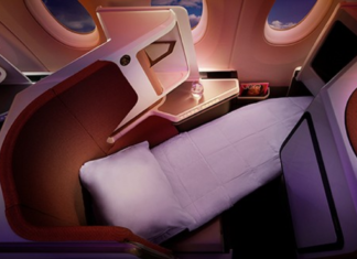 a bed and a table in a plane