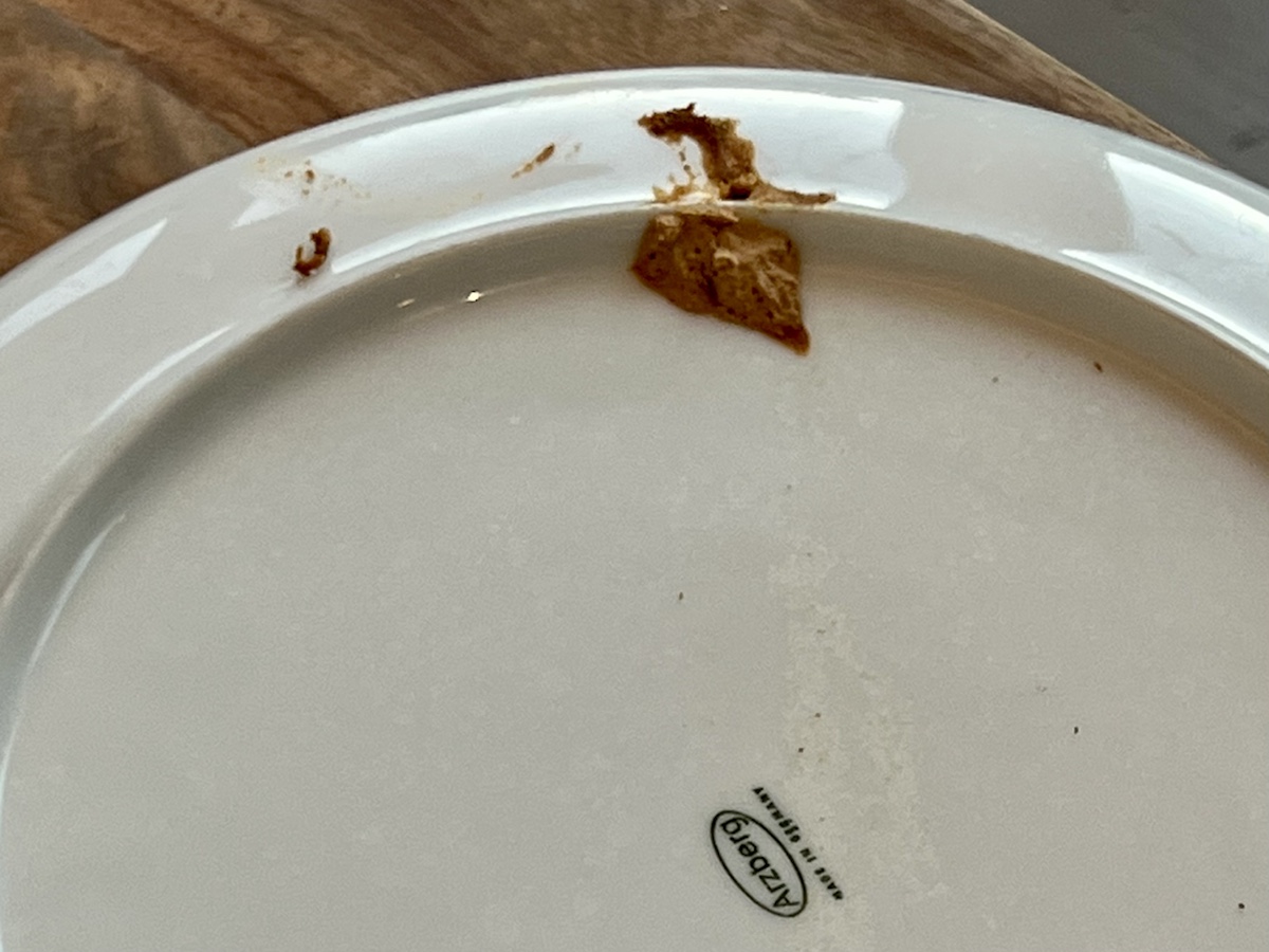 a plate with a crumb on it