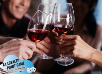 a group of people clinking wine glasses