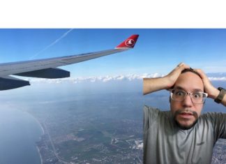 a man taking a selfie with a plane wing