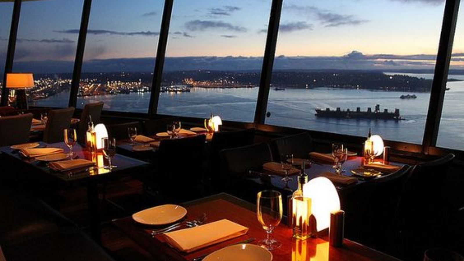 a restaurant with a view of the city
