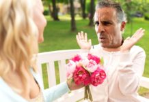 a man holding a bouquet of flowers and a woman