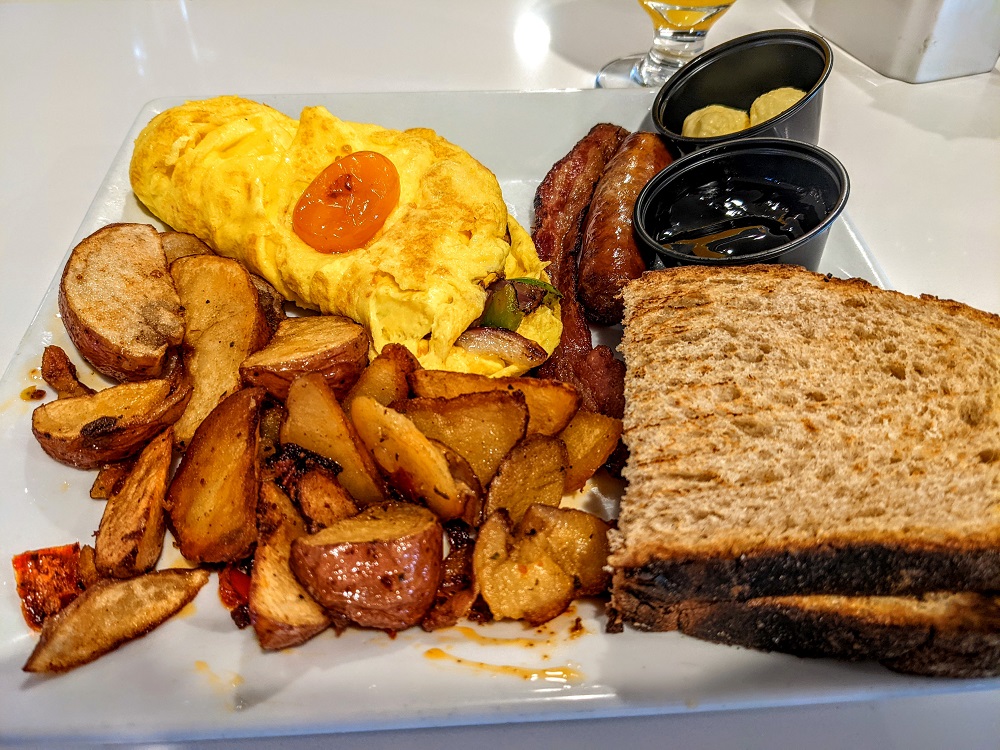 a plate of food with a toast and eggs
