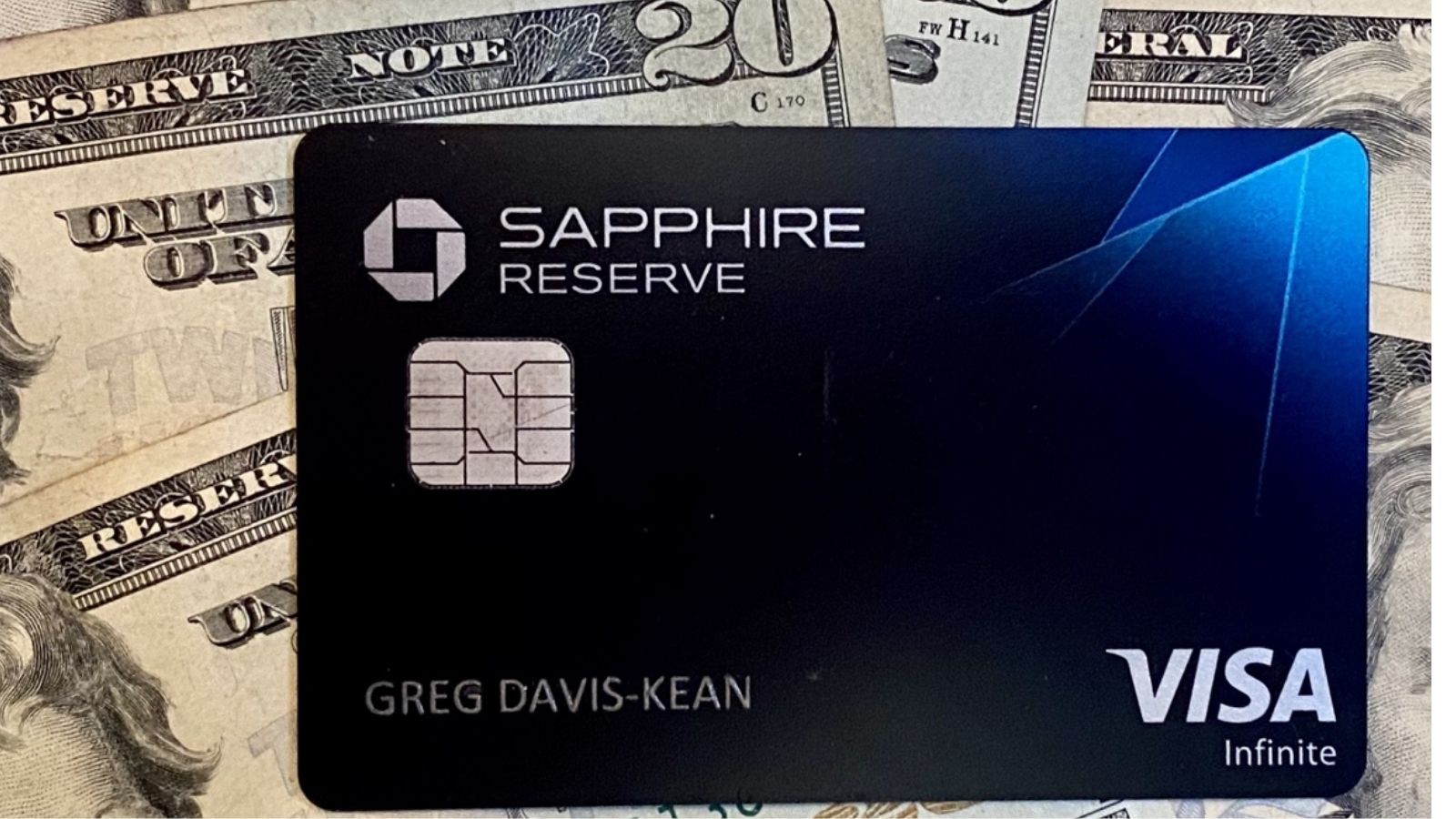 a black credit card on top of money