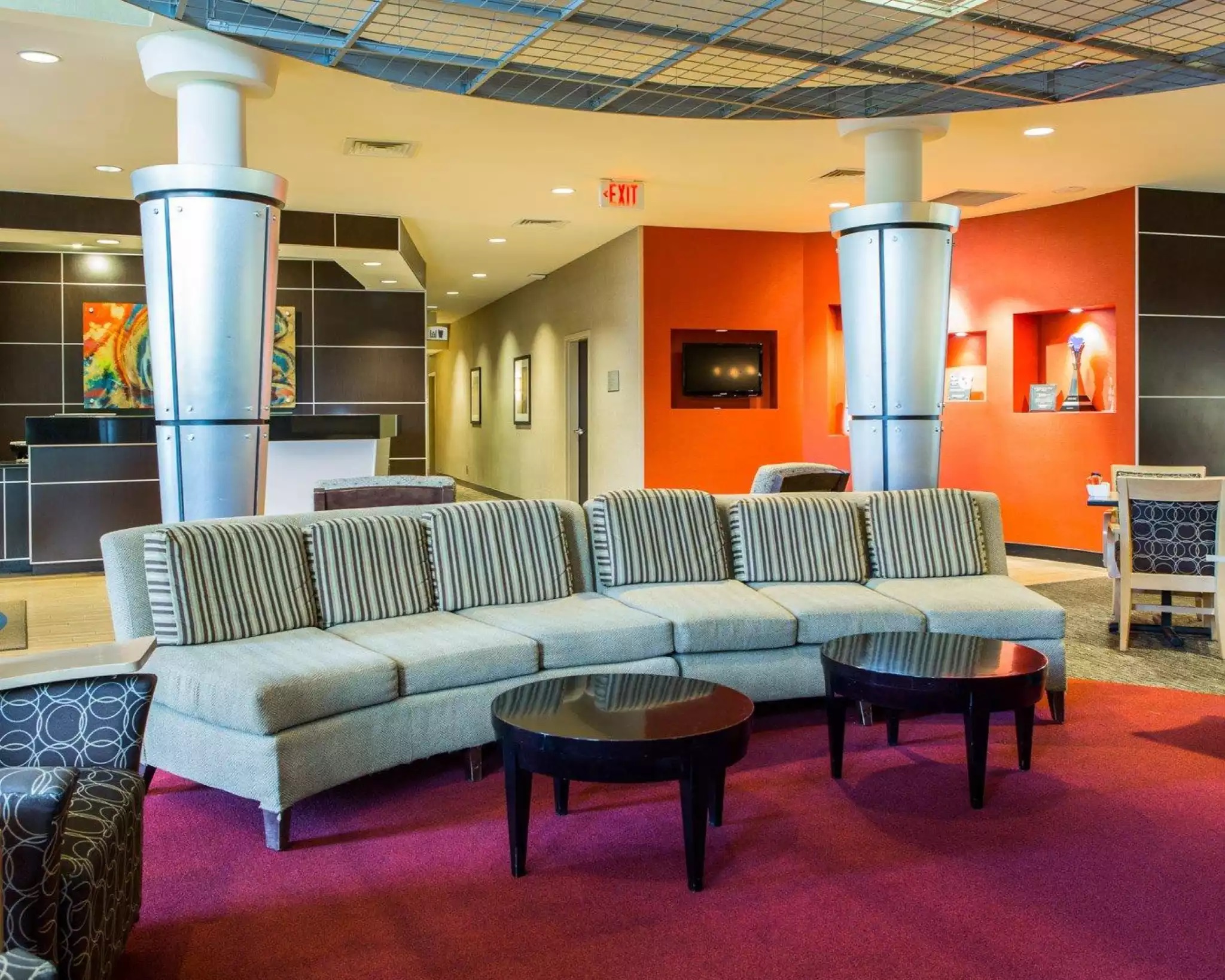 a couches and tables in a lobby