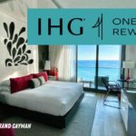 a room with a bed and a desk and a window