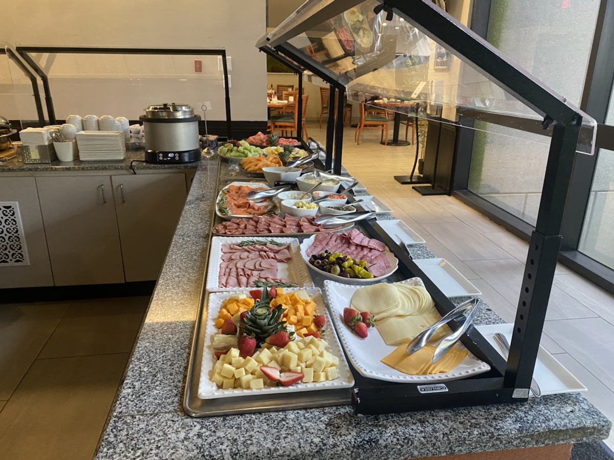 a buffet with different types of food on plates