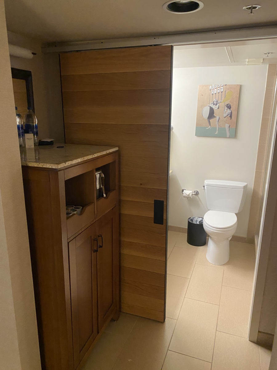 a bathroom with a wooden door