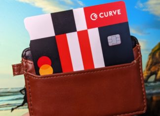 a brown wallet with a credit card in it