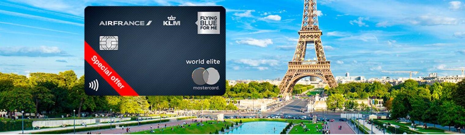 a credit card with a large tower in the background