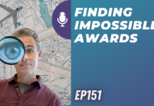 a man looking through a magnifying glass