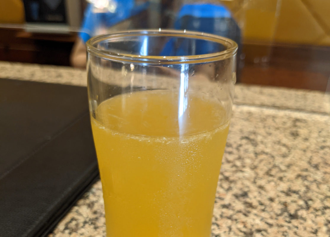 a glass of orange liquid