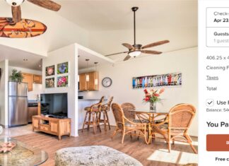 a living room with a table and chairs