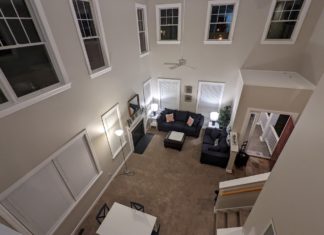 a living room with a table and chairs