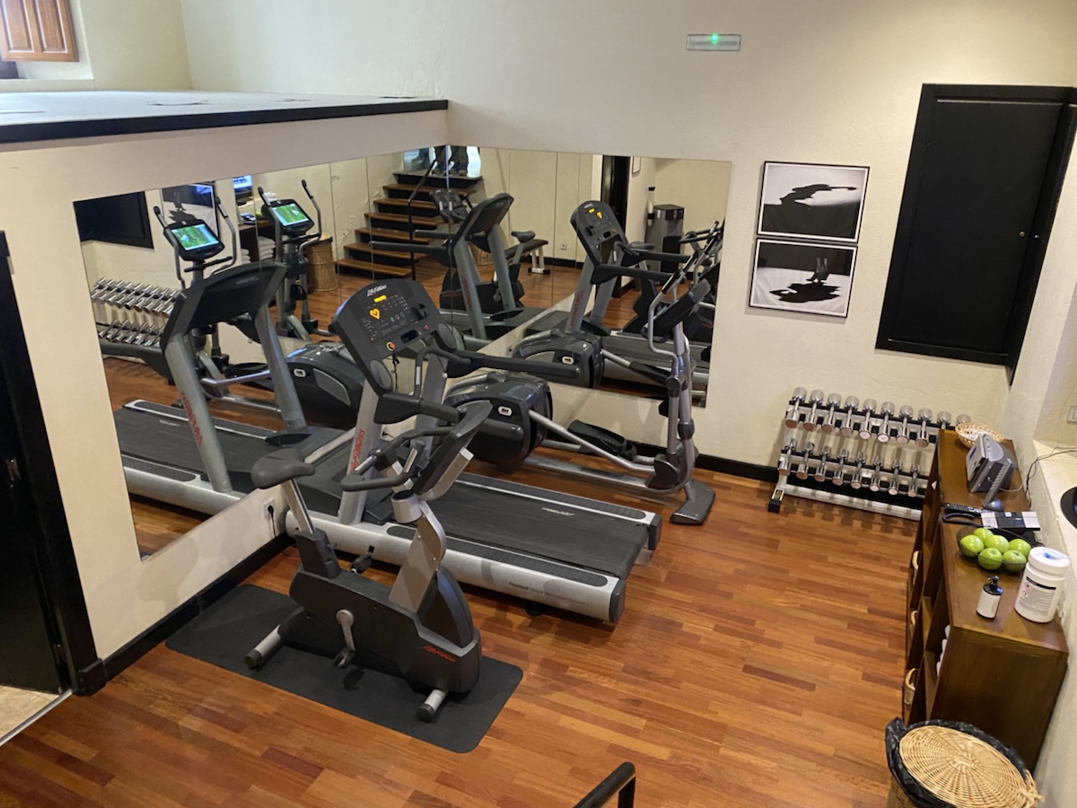 a room with treadmills and a mirror