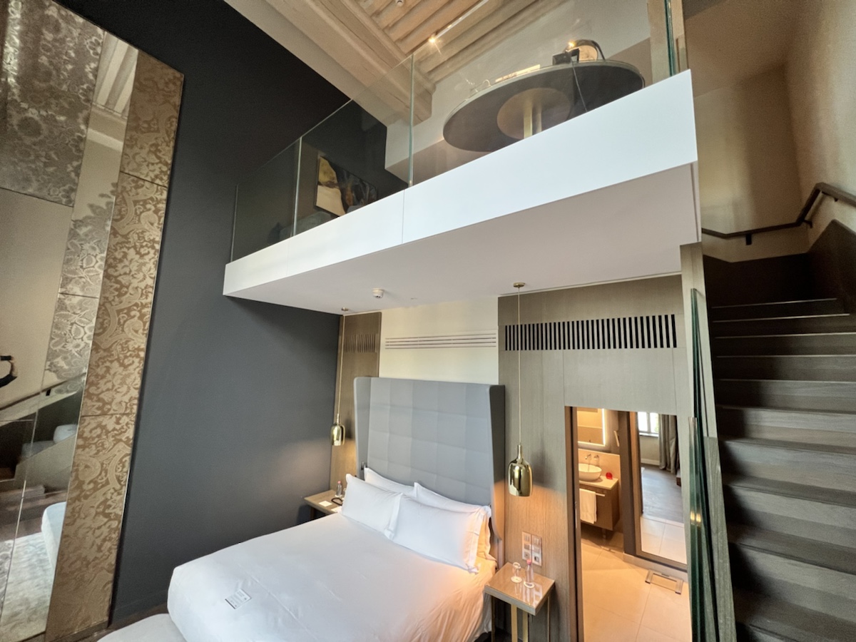 a bed with a glass balcony
